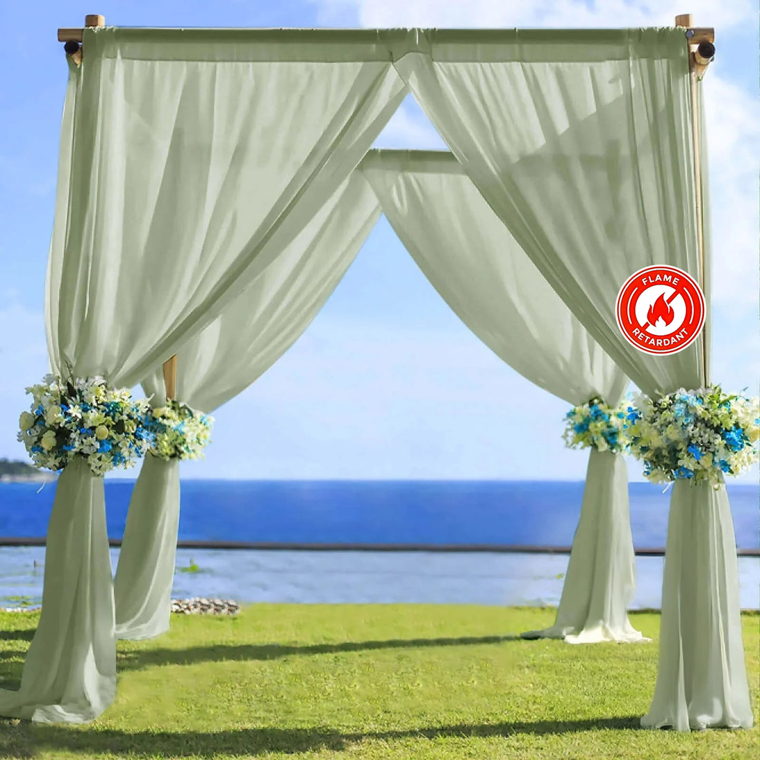 Flame-retardant wedding arch draped with green fabric and floral arrangements.