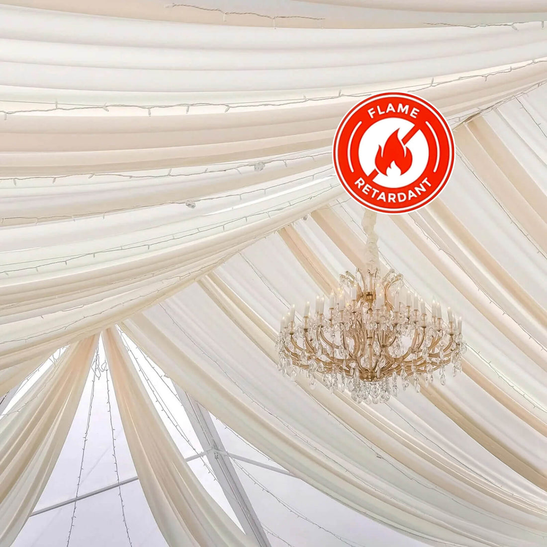 Flame-retardant fabric draping with a chandelier in an elegant setting.