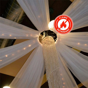 Flame retardant drapery featuring sparkling chandelier decoration.
