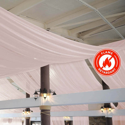 Flame-retardant fabric drapes in an elegant venue setting.