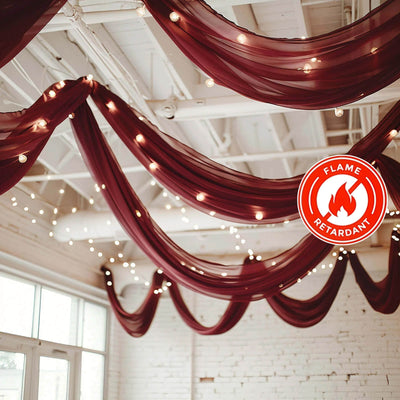 Flame retardant drapery with string lights in a beautifully staged event space.