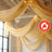 Elegant sheer drapes with chandeliers in a beautifully decorated venue.
