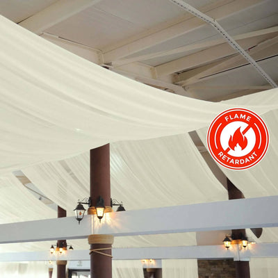 Flame retardant sheer fabric draping in a spacious venue interior.