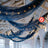 Decorative blue fabric drapes with fairy lights in an elegant venue setting.