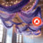 Purple sheer drapes with string lights in a decorative indoor setting.
