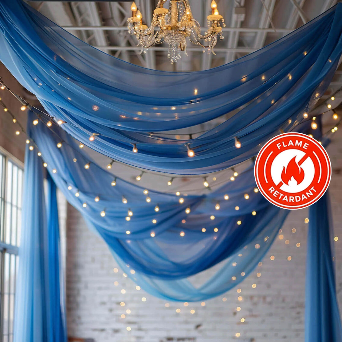 Blue sheer drapery with fairy lights and a flame retardant label.
