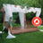 Flame retardant wooden pergola with sheer drapes and greenery in a garden setting.