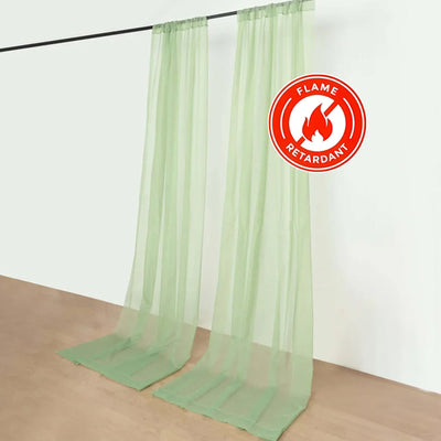 Flame retardant sheer green curtains on a white backdrop