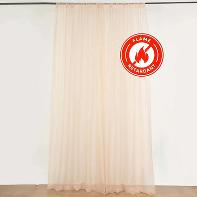 Flame retardant sheer curtain on a plain backdrop
