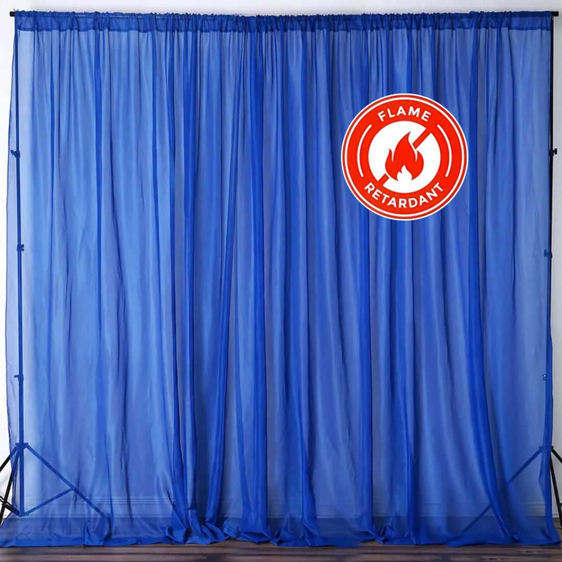 Blue flame retardant curtain with logo on a studio backdrop. #whtbkgd