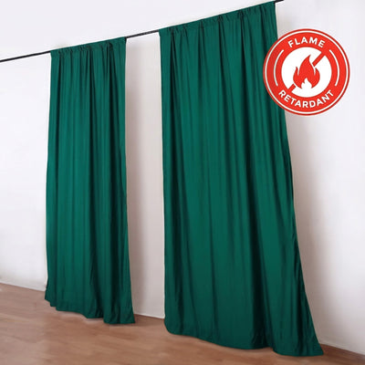 Flame retardant green stage curtains on a hanging rod