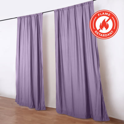 Purple flame-retardant curtains on a rod in a room, with fire safety badge