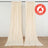 Beige flame retardant curtains hanging against a plain backdrop.
