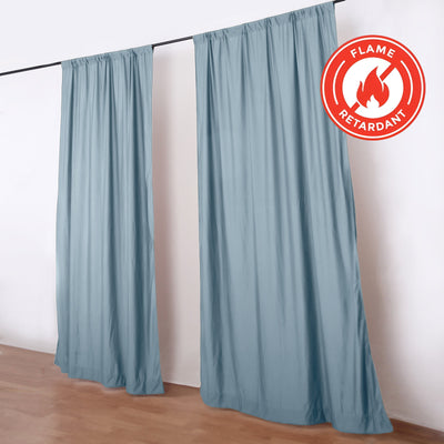 Blue flame retardant curtains on a rod with fire-resistant badge