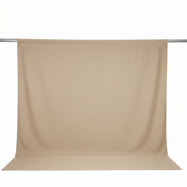 Beige seamless backdrop paper roll on studio background 
