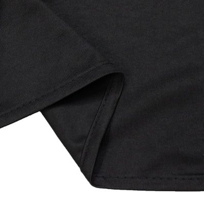 Black ribbed knit fabric close-up texture with folded hem