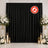 Black flame retardant curtain backdrop with white floral wedding decor and candles