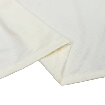 Close-up of ivory ribbed fabric with folded hem detail