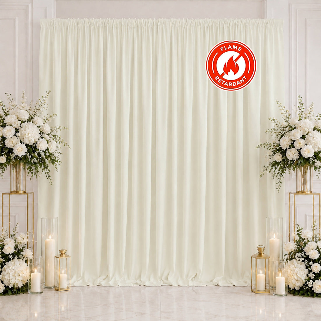 Elegant ivory wedding backdrop with white floral arrangements and candles, flame retardant