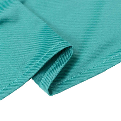 Turquoise ribbed fabric close-up with folded hem detail