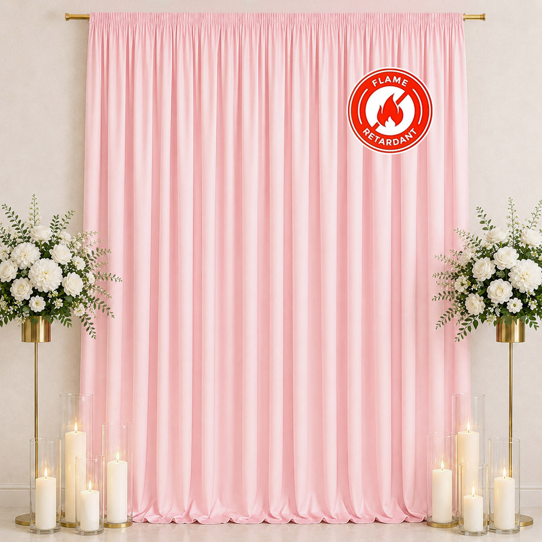 Pink satin backdrop with floral arrangements and candles, flame retardant banner