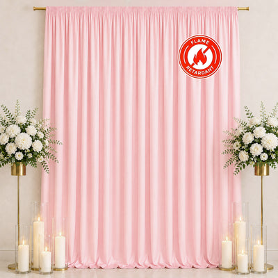 Pink satin backdrop with floral arrangements and candles, flame retardant banner
