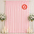 Pink satin backdrop with floral arrangements and candles, flame retardant banner