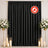 Black flame-retardant curtain backdrop with white floral candle arrangement
