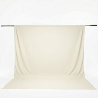 Cream photography backdrop with floor sweep on a metal support rod#whtbkgd