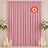 Pink flame retardant curtain backdrop with floral stands and candles