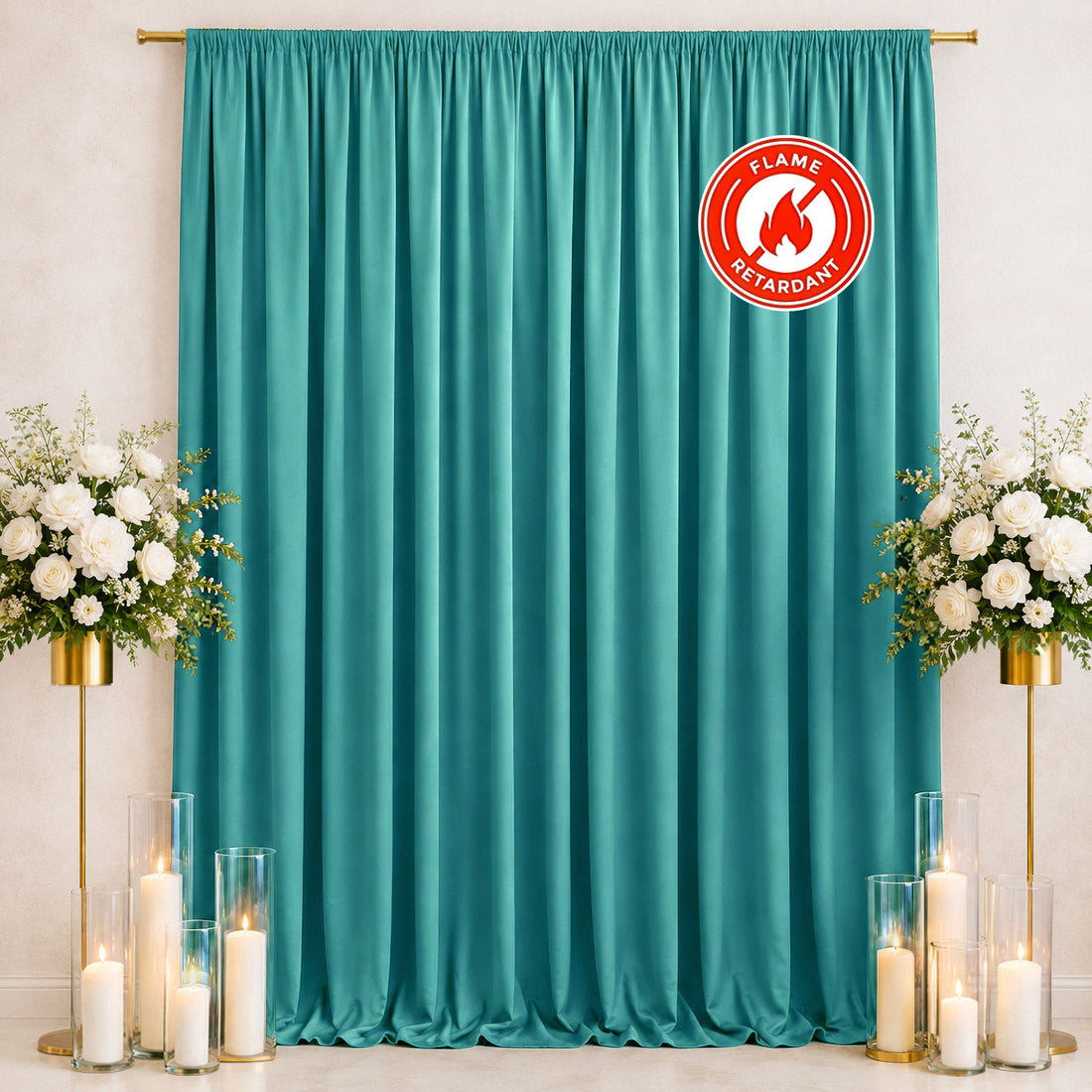 Teal flame-retardant curtain backdrop with floral arrangements and candles