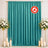 Teal flame-retardant curtain backdrop with floral arrangements and candles