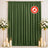 Green flame retardant curtain with floral decor and candles backdrop