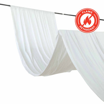 Flame retardant white fabric draped on a rod for safety and style.