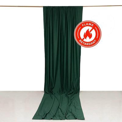 Green flame-retardant curtain draped on a rod against a white background