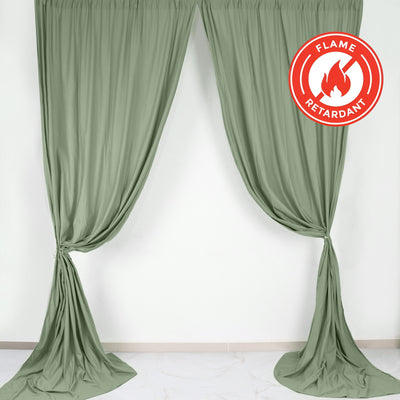 Flame retardant green curtains draped elegantly in a studio setting.