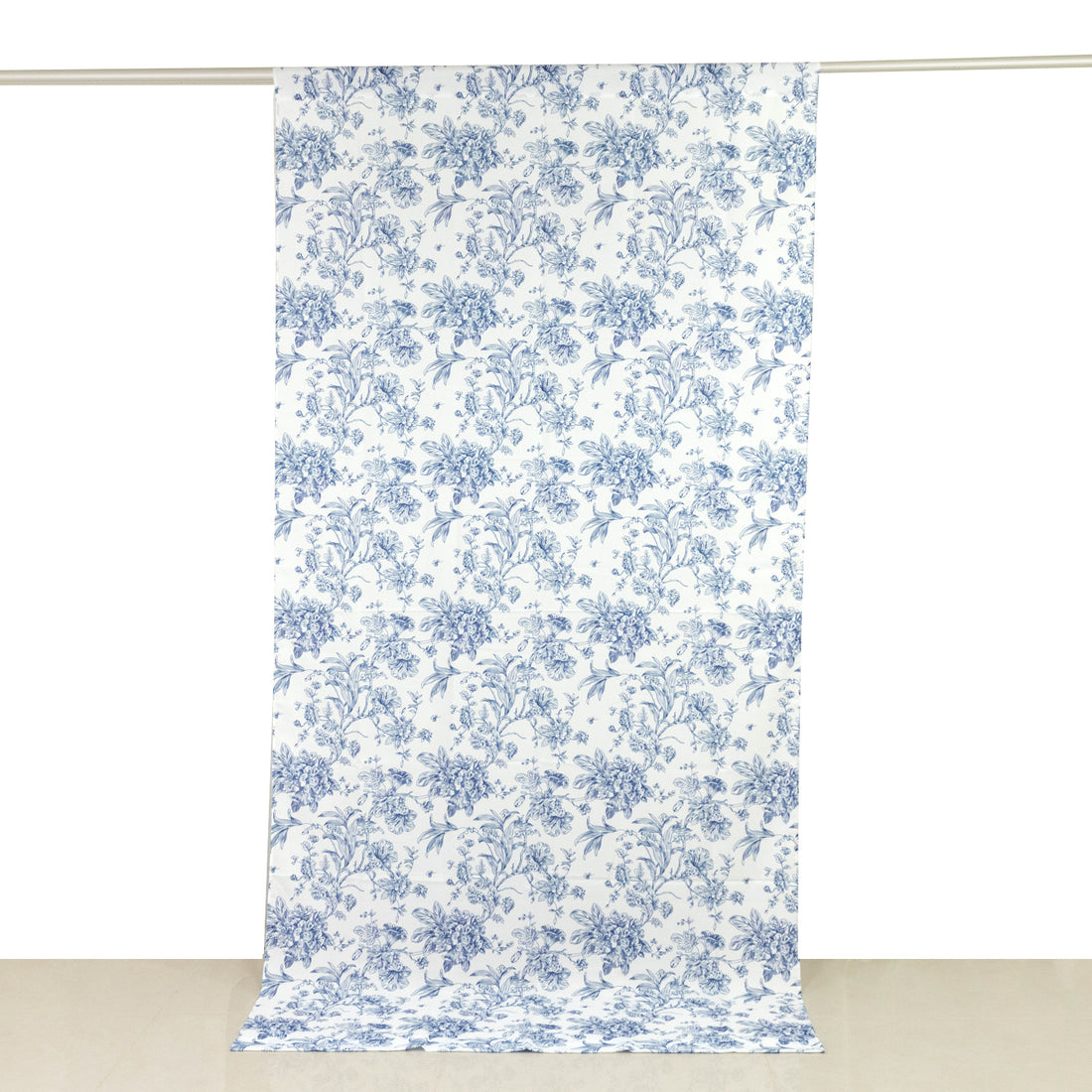 Blue floral patterned fabric on a white backdrop.