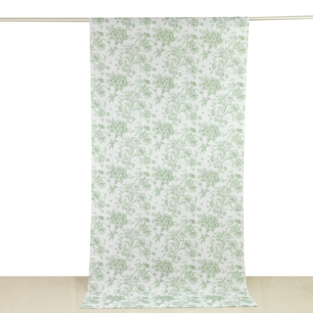 Floral patterned fabric draped vertically on a white backdrop