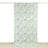 Floral patterned fabric draped vertically on a white backdrop