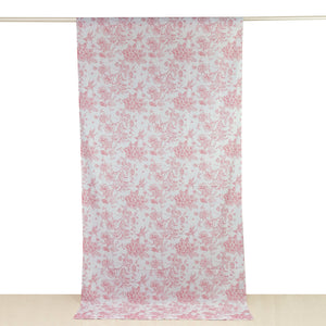 Pink floral patterned fabric hanging on a curtain rod.