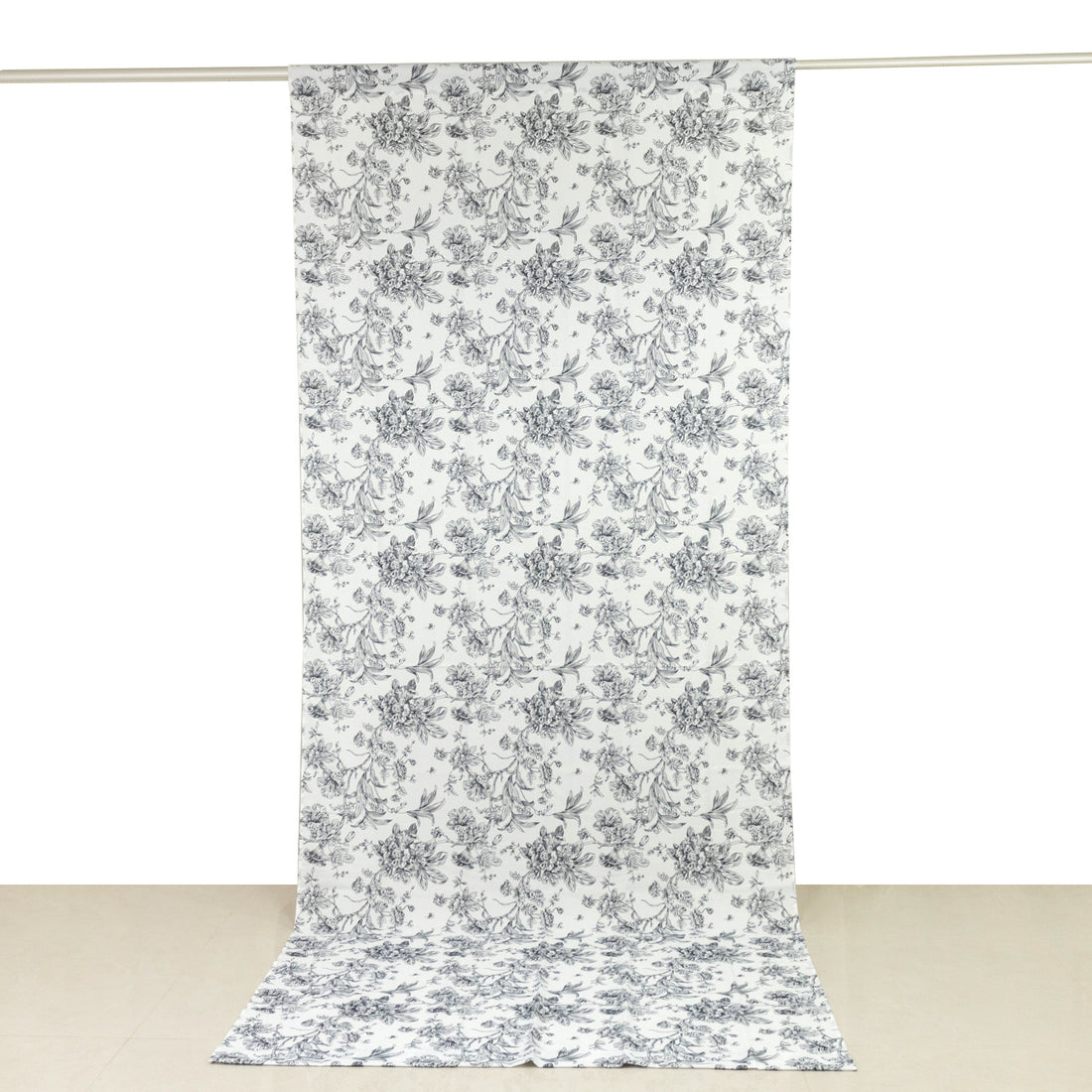 Floral patterned fabric roll on a plain background