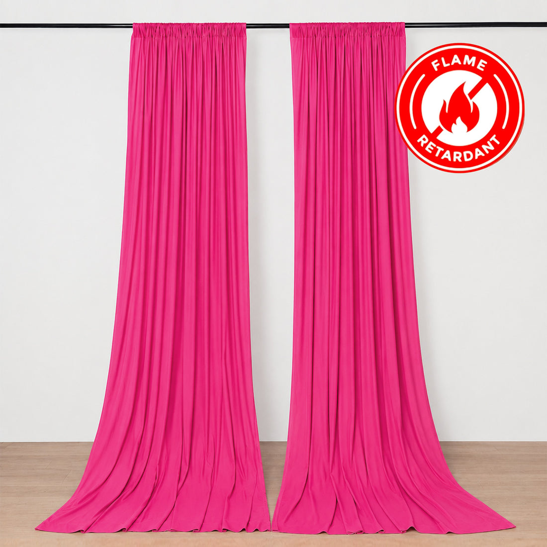 Hot pink flame retardant curtains hanging on a rod in a room
