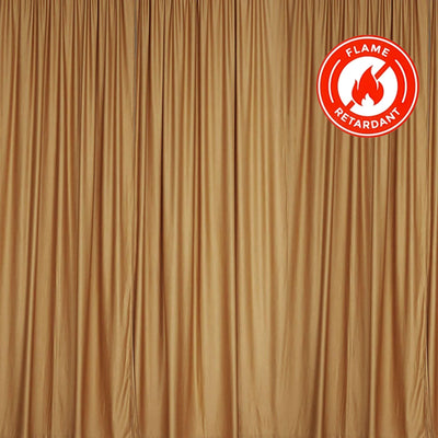 Flame retardant gold curtain fabric hanging in folds. #whtbkgd