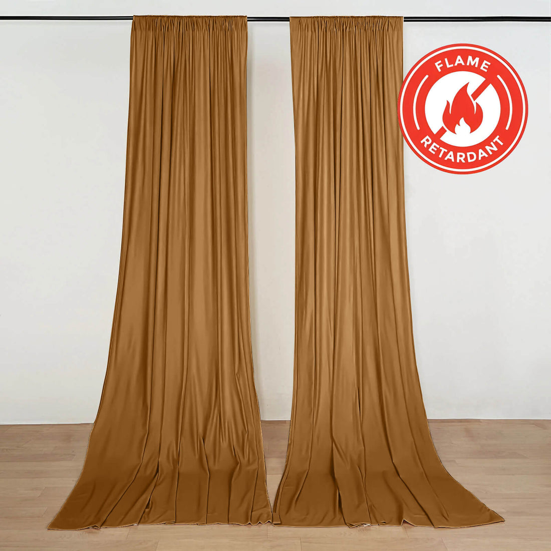 Flame retardant gold curtains hanging on wall with certification logo