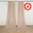 Beige flame retardant curtains hanging on a wall with floor-length drape
