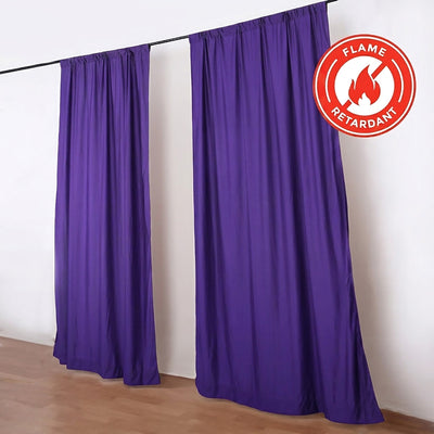 Purple flame retardant curtains hanging on a black rod in a room