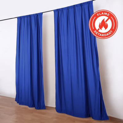 Blue flame retardant curtains hanging on a rod in a room