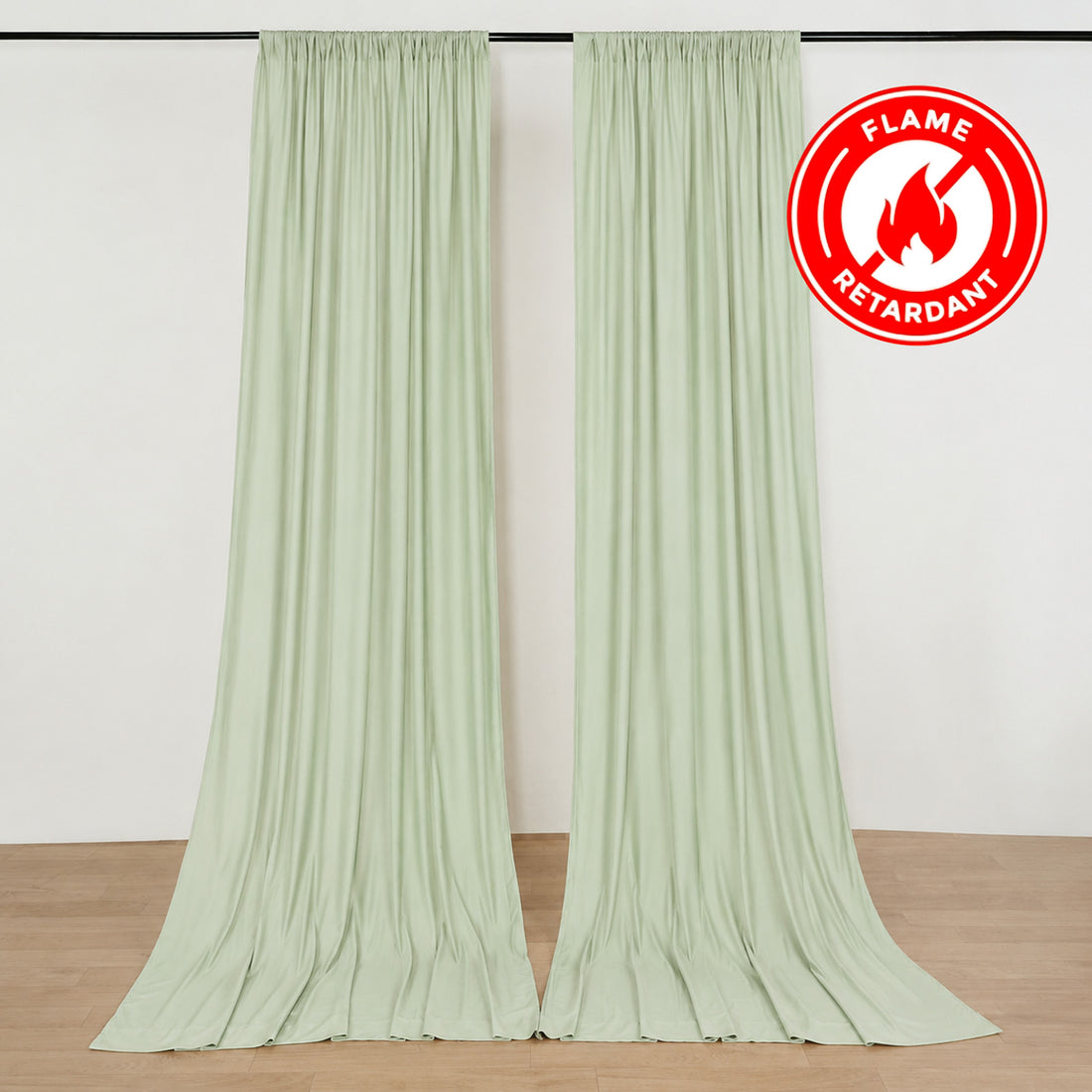 Light green flame retardant curtains hanging on a rod in a room