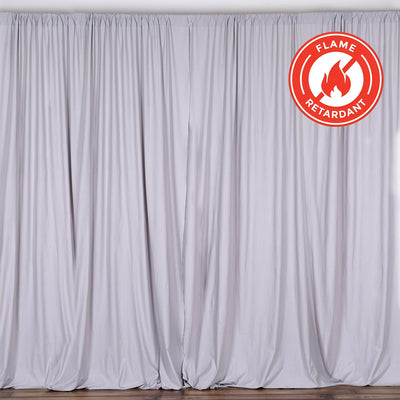 Flame retardant curtain in soft gray fabric, neatly draped #whtbkgd