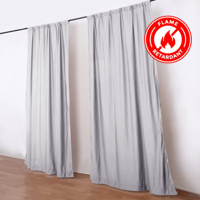 Fire retardant gray curtains on a black rod in a modern room